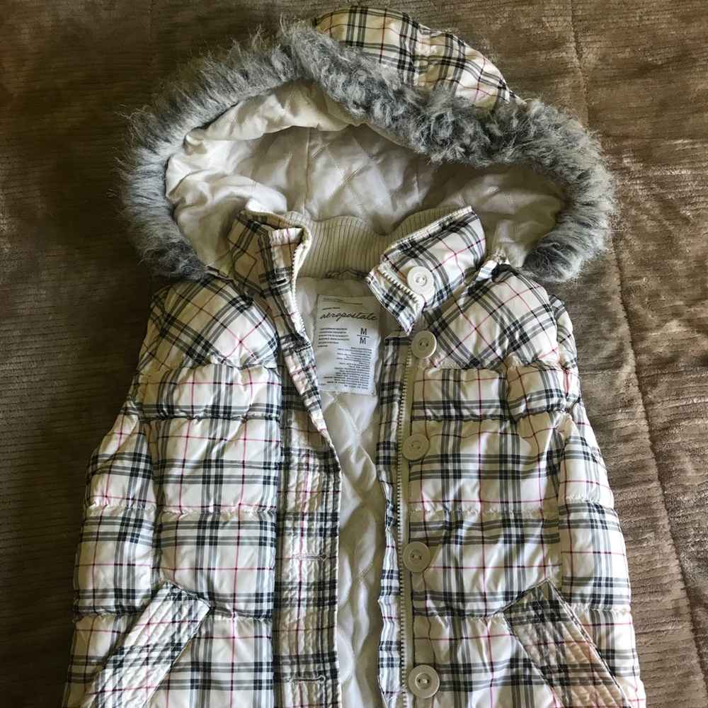 Vest with detachable hood